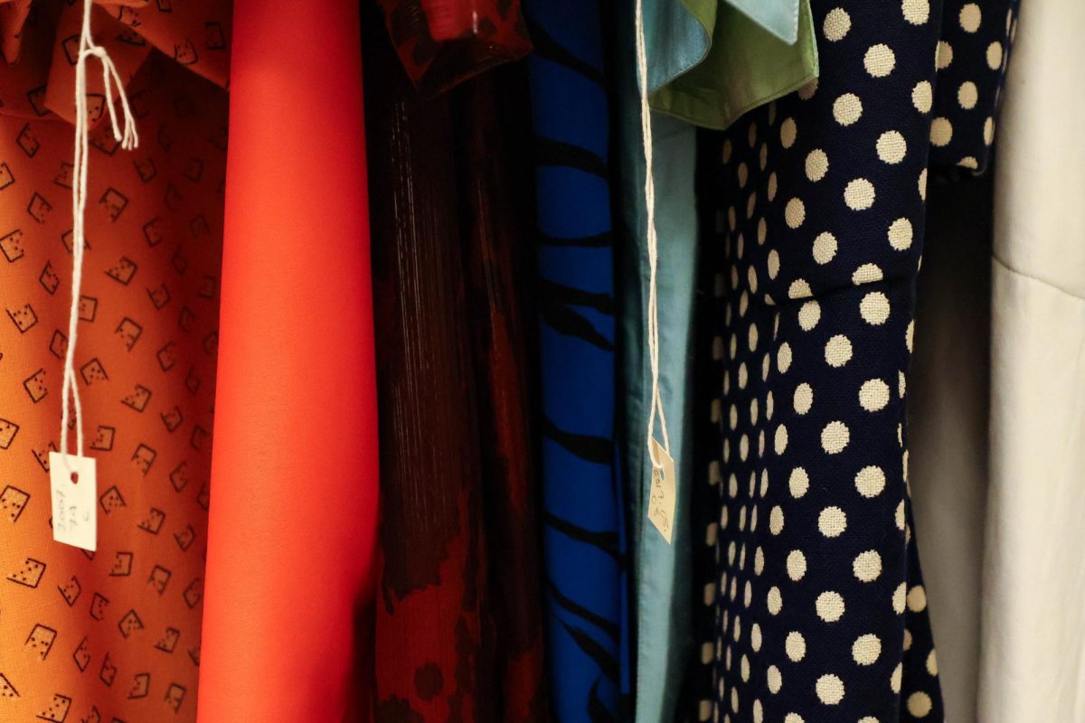 Designs of Oscar de la Renta hang in the Avenir Museum cabinets, showcasing the designer's early works along with many others, Oct. 5. 