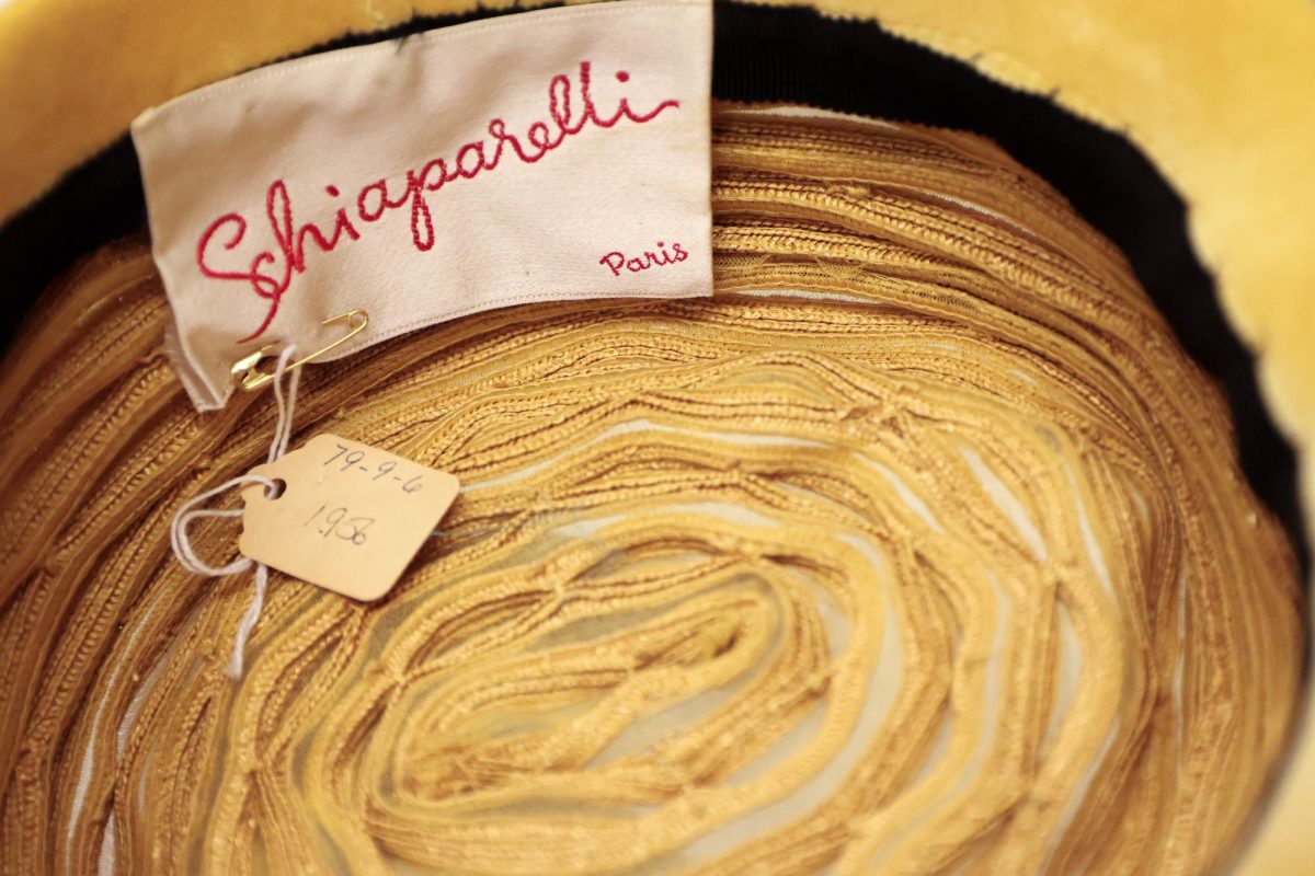 The inside of a textured yellow hat by designer Elsa Schiaparelli showcases tag and lightly worn fabrics in The Avenir Museums' archived collection, Oct. 5. 