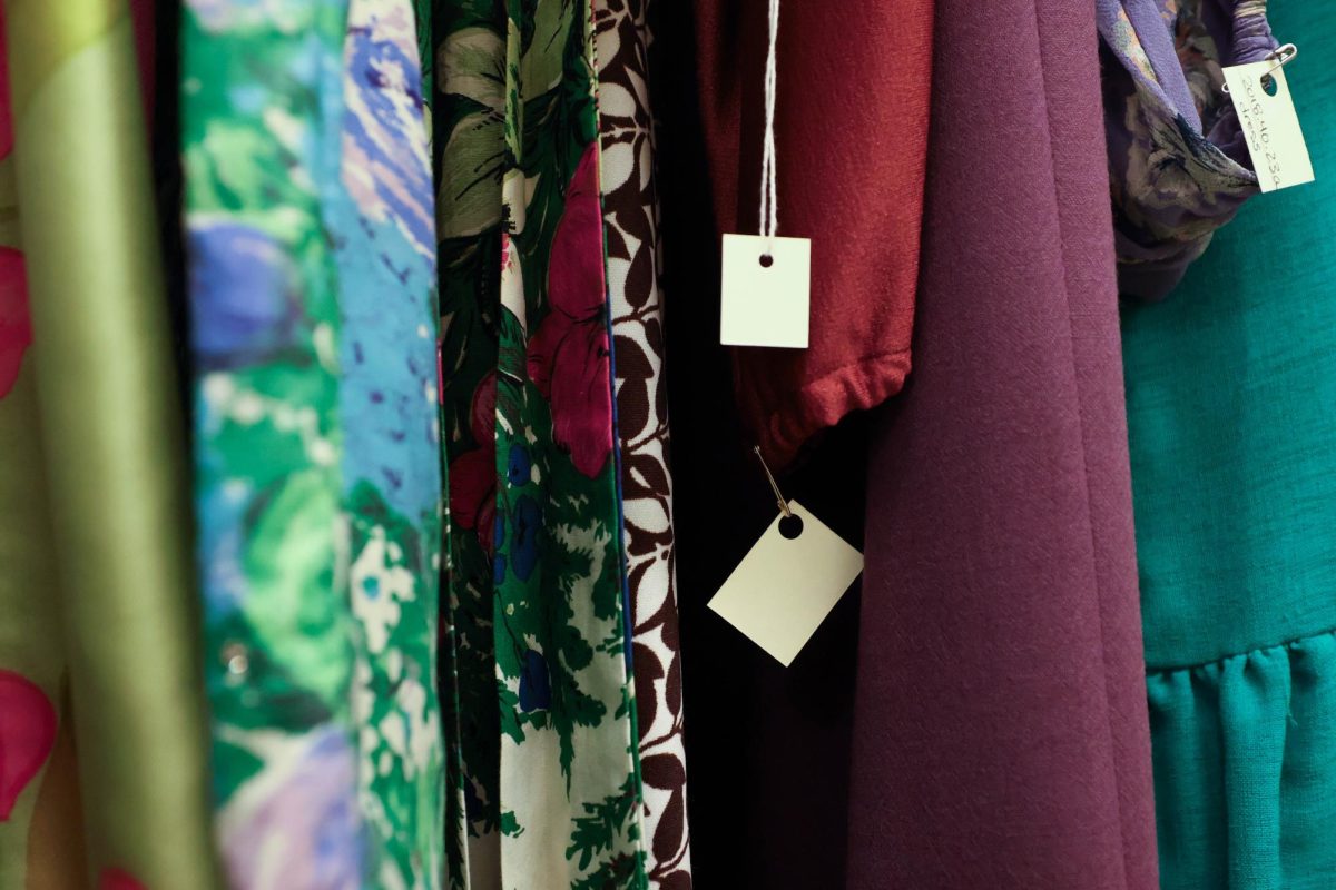 Clothing hangs in the cabinets of the Avenir Museum, each cabinet sorted by decade, designer, or object type. The tags date when the piece was donated to the collection, as about 90% of the collection has been provided through donation, Oct. 5. 
