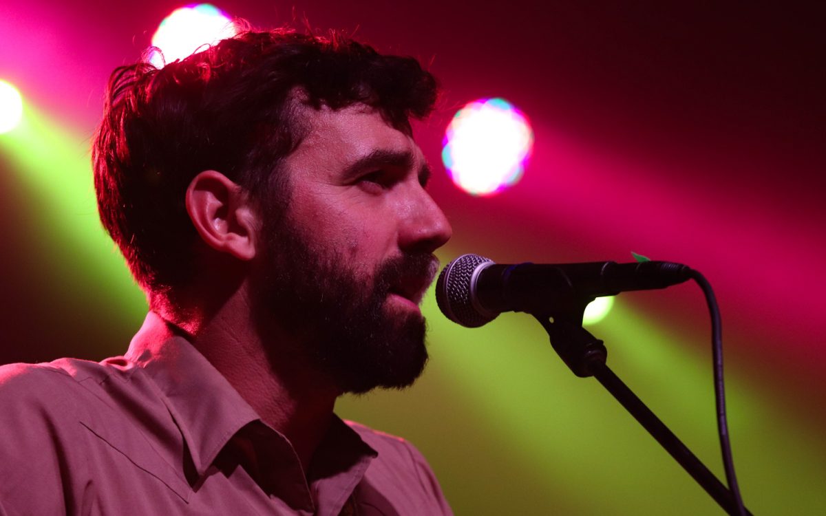 Ryan Acker sings with his band, The Last Revel, at the Aggie Theatre Oct. 9. The song was about the trials and tribulations of marriage, as both him and his partner are touring musicians. 