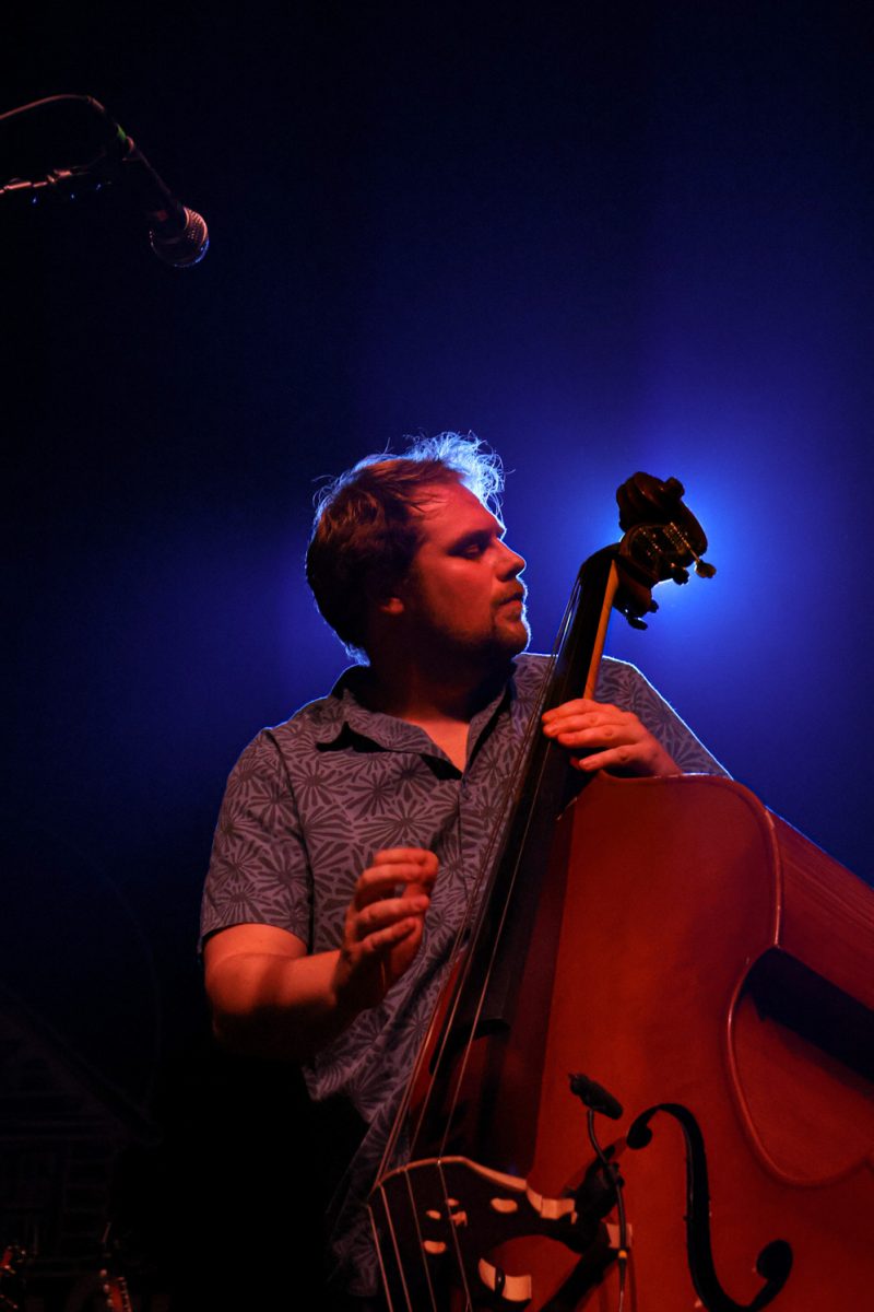 Ryan Krauss plays standing bass with The Last Revel during their performance at the Aggie Theatre Oct. 9. The band is joining Oliver Hazard on their 'Raindrop River Tour,' trading off headlining performances. "I'm excited to just see what it feels like when it switches to have the crowd already fired up,” said Ryan Anchor, Krauss's bandmate. 