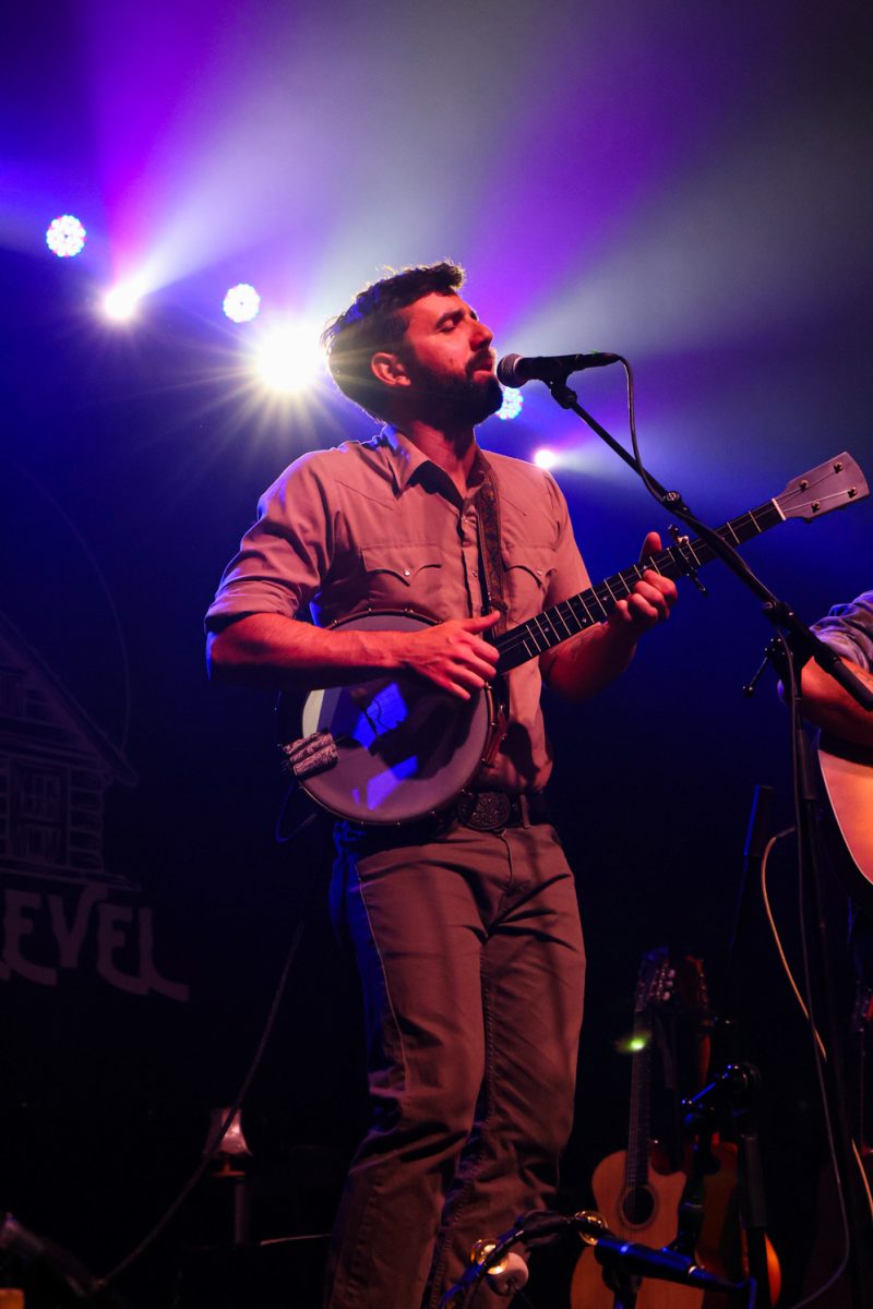 Ryan Acker sings and plays banjo with band The Last Revel at the Aggie Theatre Oct. 9. "We're just so happy to be part of it," Acker said. 
