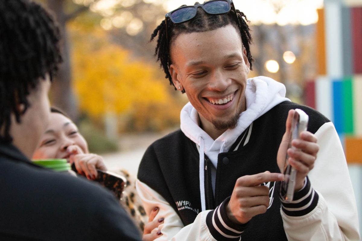 Jakye Nunley, president of ASCSU laughs with other students at the Pumpkin Palooza event hosted by APACC and ASCSU at the Lory Student Center in Fort Collins Colorado, Oct. 28. "It's nice to have a space I'm more familiar with." Said  APACC member Stefania Miranpa.