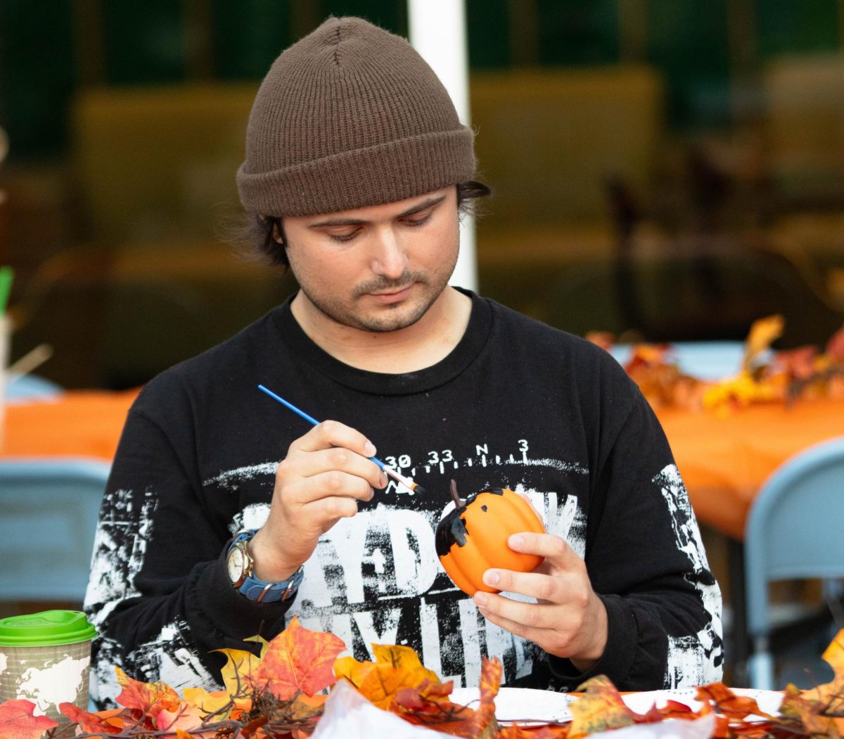 Participant paints a pumpkin at ASCSU and APACC's Pumpkin Palooza event in Fort Collins Colorado, Oct. 28. "It's such a cute event." APACC member Divisha Khadka.