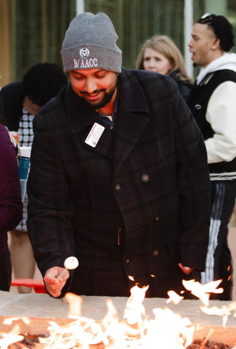APACC employee Gaurav Harshe roasts marshmellows at ASCSU and APACC's Pumpkin Palooza event at the Lory Student Center in Fort Collins Colorado Oct. 28. "It's a good space to come and decompress and just hang out while everything in the world is going on around you." Said Harshe.