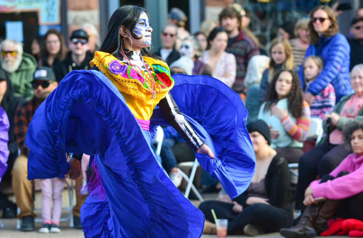 A beautiful dancer performing a traditional dance alongside two other dancers Nov. 1. This traditional dance is to celebrate Dia de Los Muertos, a holiday where we honor our loved ones who have passed away and to celebrate life. 
