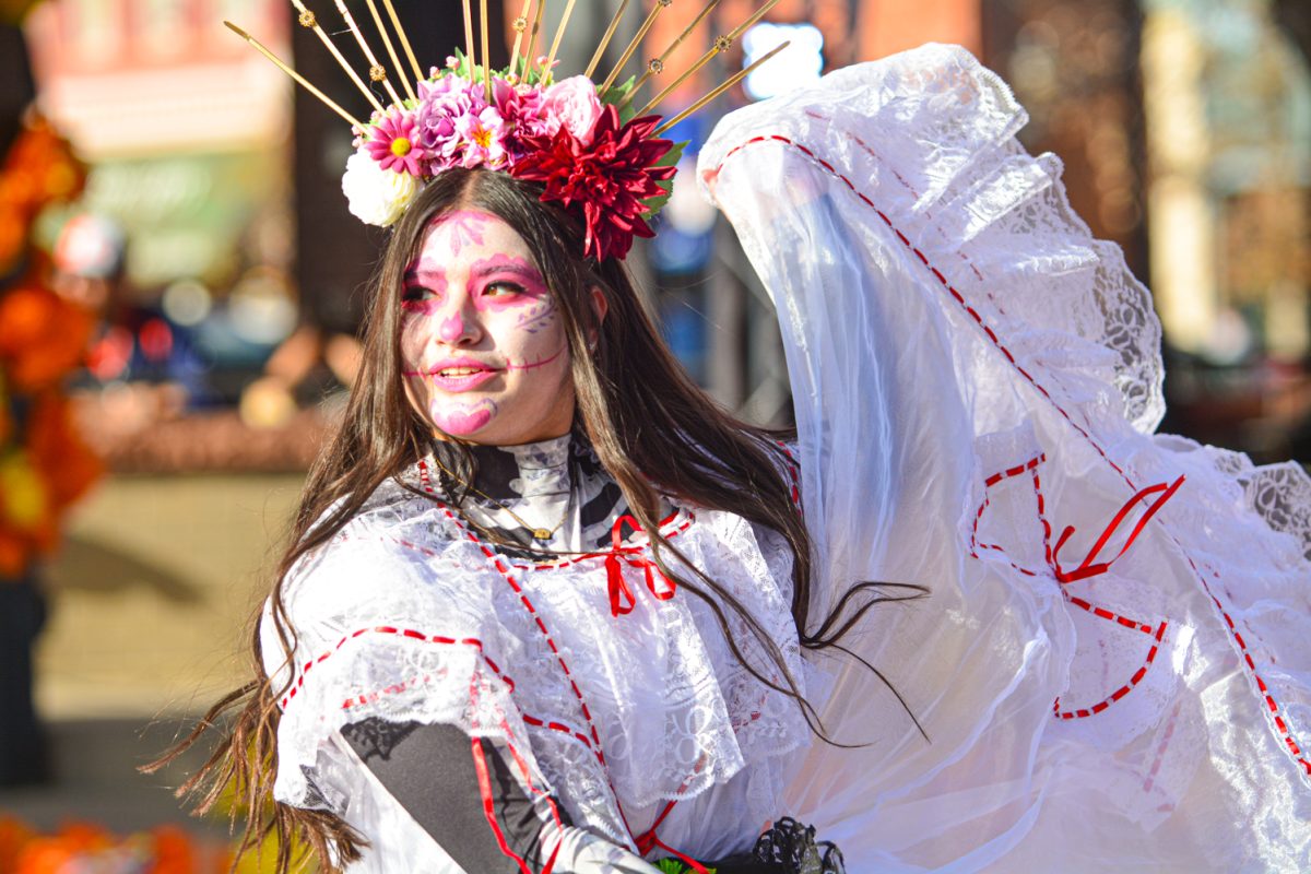 One of the many beautiful dancers celebrating Dia de Los Muertos in Old Town Nov. 1.  This event had many dancers from Aztec warrior kids to adults performing traditional dances. 