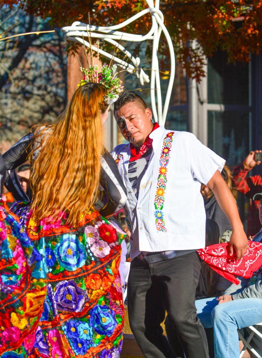 Two dancers perform a traditional Mexican dance celebrating the holiday Día de Muertos Nov. 1. This celebration took place in Old Town Square and featured a variety of musical pieces, dances and drinks.
