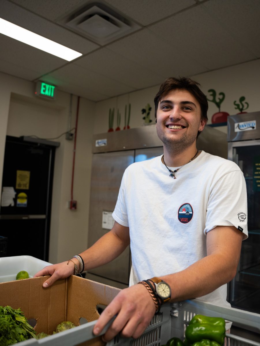 Nick Salis, who works with Rams Against Hunger, sorts food donations Nov. 6. The food pantry is open four days a week to Colorado State University students, staff and faculty. 