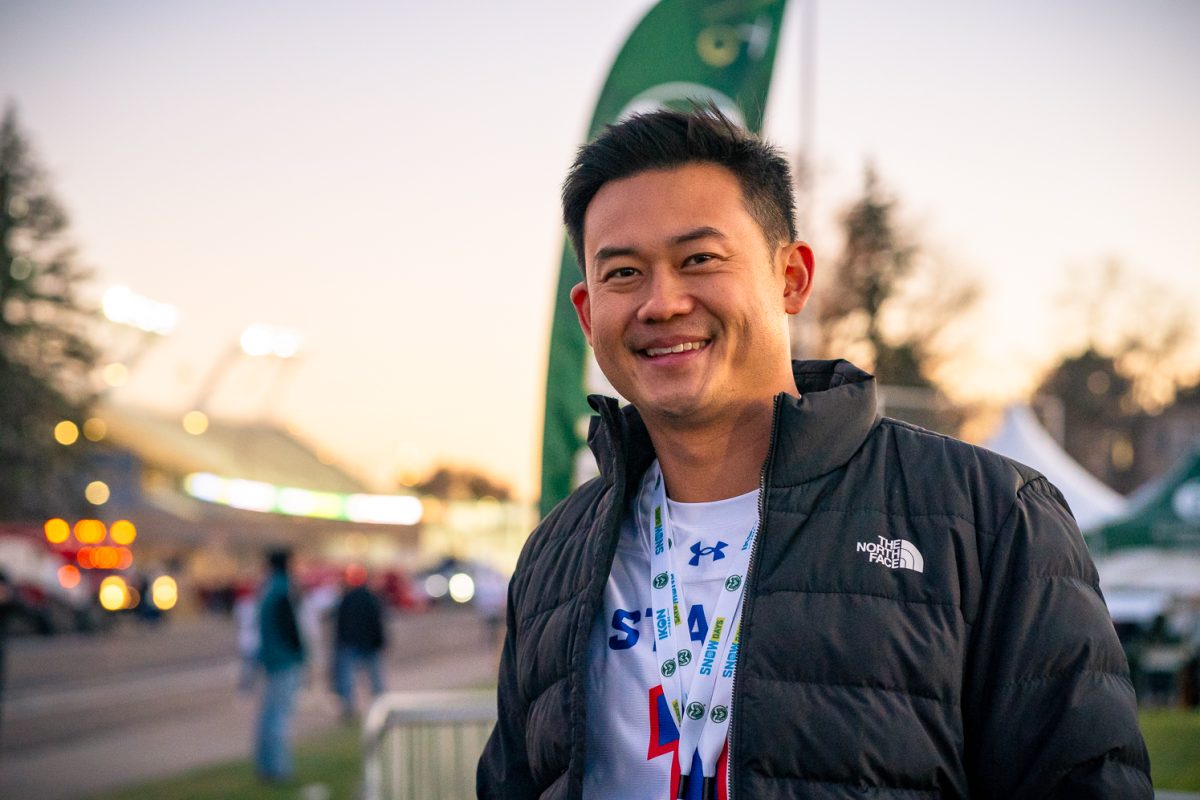 Colorado State Alumn Patrick Suzuki poses for a photo at the President's Tailgate outside Canvas Stadium before the football game Saturday, Nov. 8. Suzuki gained attention this year as a contest on the ninth season of the Netflix reality dating show Love is Blind. Before his foray into reality television, Suzuki studied construction management at CSU before moving to Denver. 