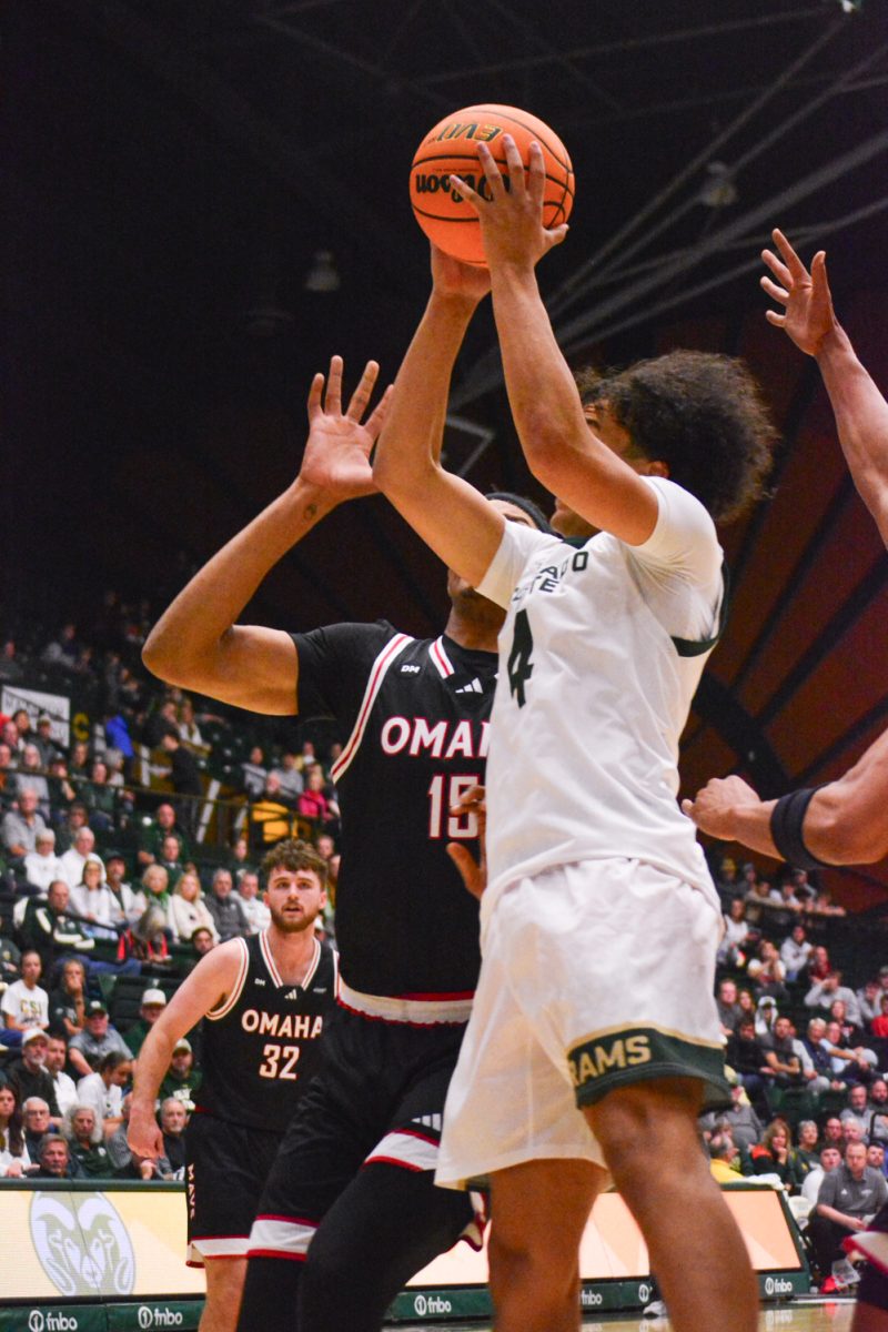 Jase Butler attempted to score two points for Colorado State University but was blocked by an Omaha player Nov. 9. CSU defeated Omaha 97-74. 