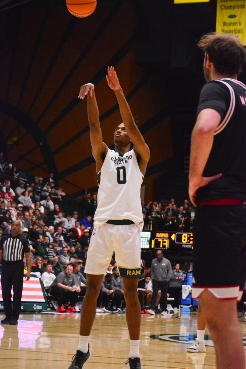 Colorado State University basketball forward Carey Booth (0) shoots a free throw after getting fouled by a University of Omaha player Nov. 9. 