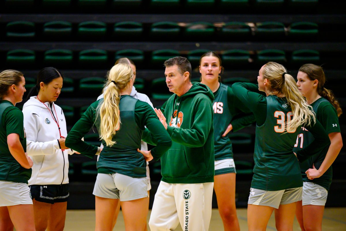 Colorado State University women's basketball coach Ryun Williams talks to players in between drills at practice Nov. 19.