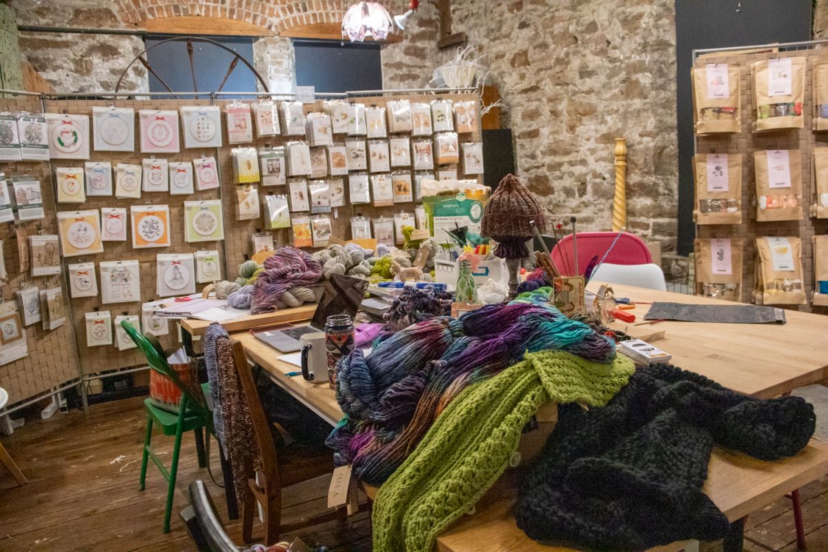 Yarn and tools sit on a workshop table in the Twisted Stitch Nov 22. The store opened on May 1 according to Nadia Hare.