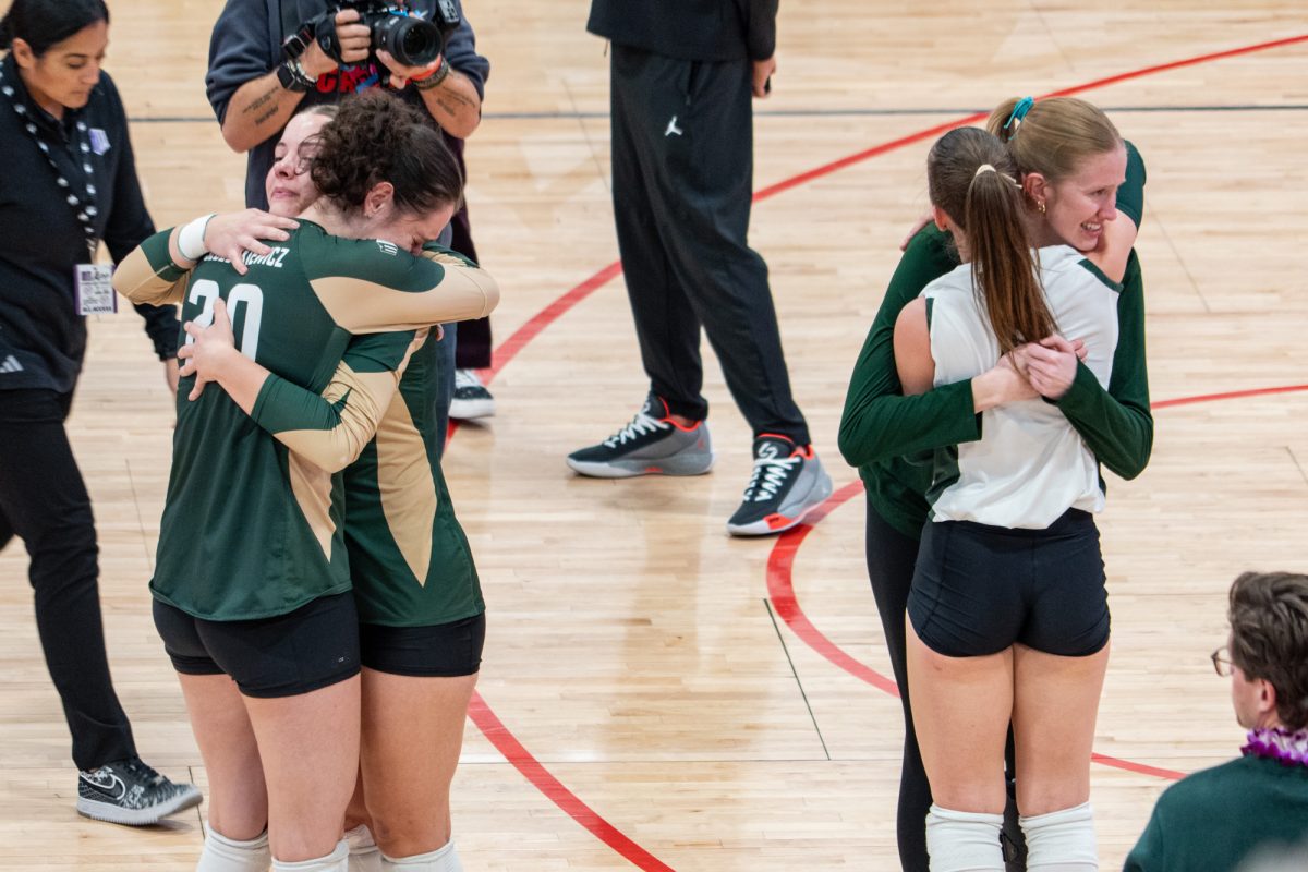 Four of five seniors for Colorado State University embrace each other after losing 3-0 to Utah State University. CSU’s season is now done. 