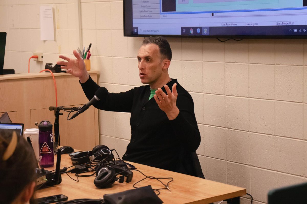 Ryan Warner, broadcast host at Colorado Public Radio, advises students in a media writing class at Colorado State University in Fort Collins Colorado, Nov. 3. "A lot of what broadcast is, I find is anticipating." Said Warner.