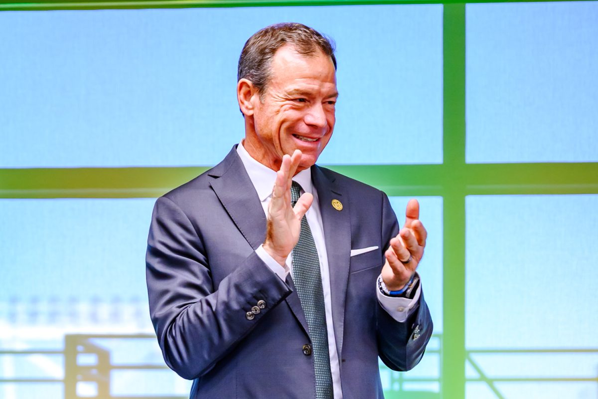 Colorado State University head football coach Jim Mora claps along to the CSU fight song during a press conference held to introduce him to the CSU community Dec. 1, 2025.