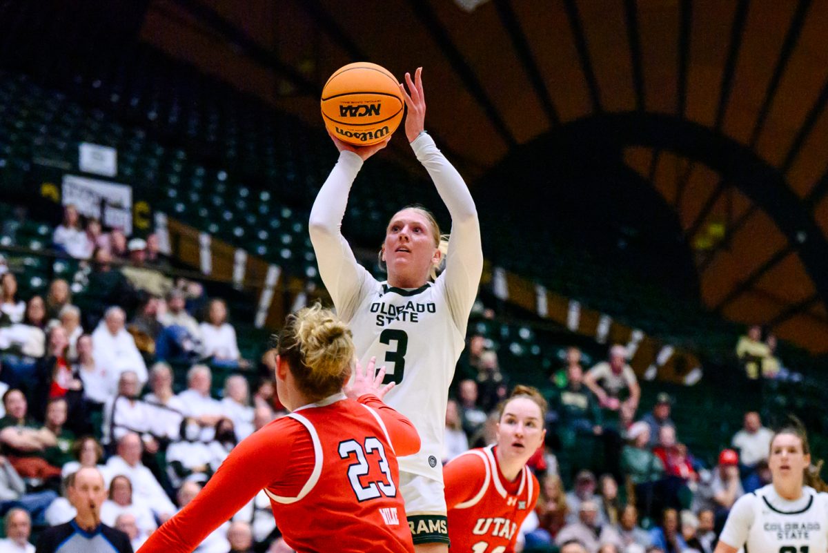 Colorado State University women's basketball guard Lexus Bargesser (3) makes a shot while University of Utah defenders put on pressure during CSU's game against UU Dec. 4.