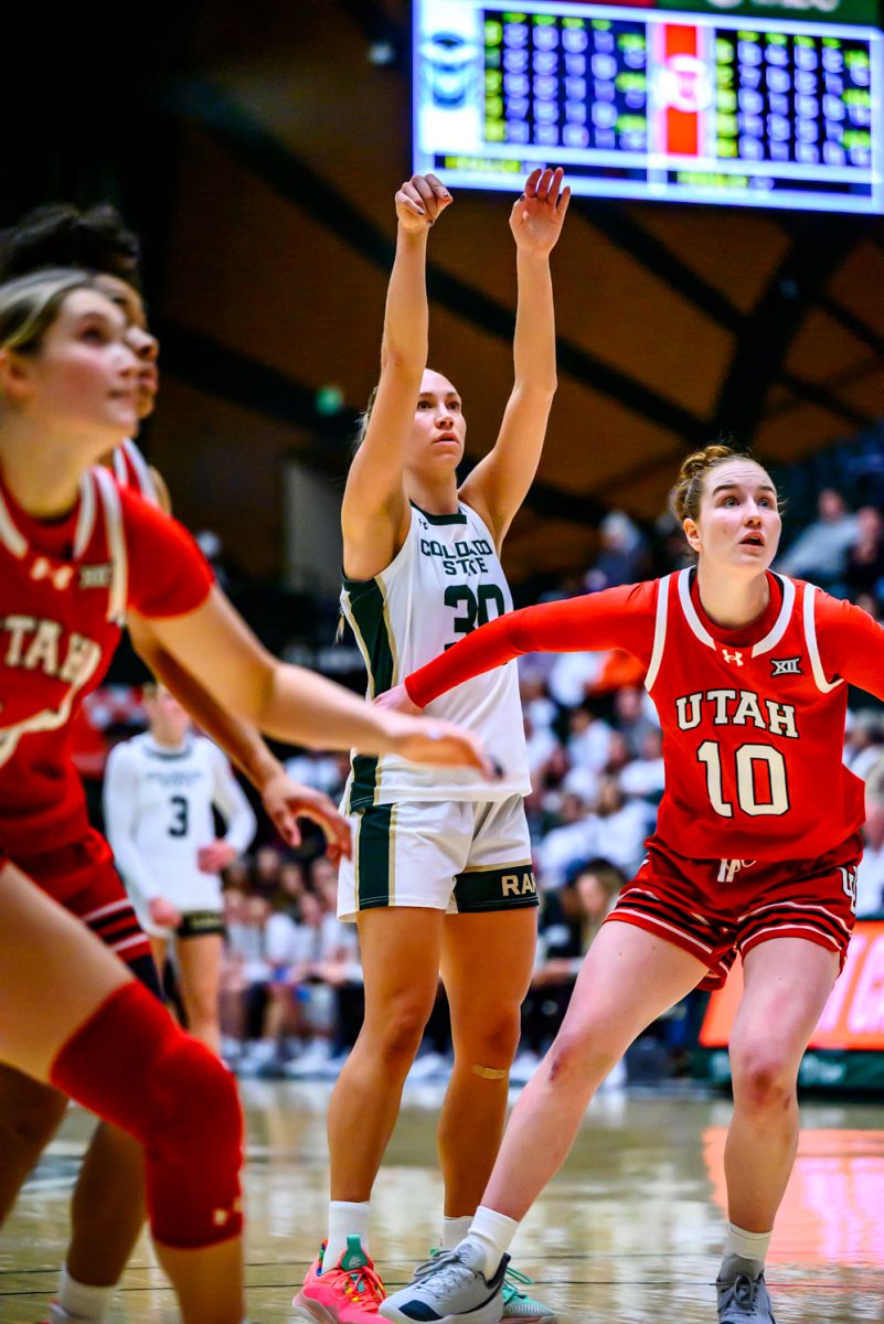 University of Utah defenders rush to ggrab a rebound from Colorado State University women's basketball guard Hannah Ronsiek (30) after a free throw Dec. 4. CSU played UU in Moby Arena for their white-out game and lost 70-58.