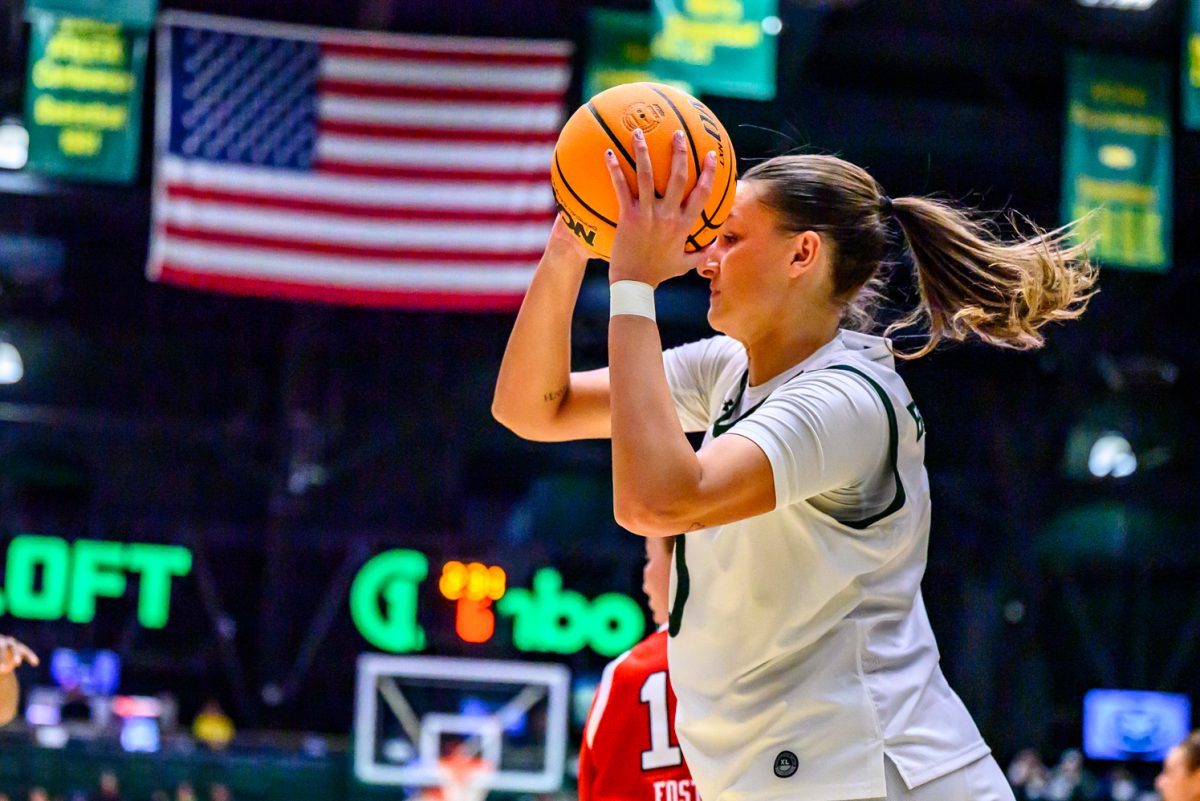 Colorado State University women's basketball forward Madelyn Bragg (0) looks to throw the ball to a teammate during CSU's game against the University of Utah Dec. 4.