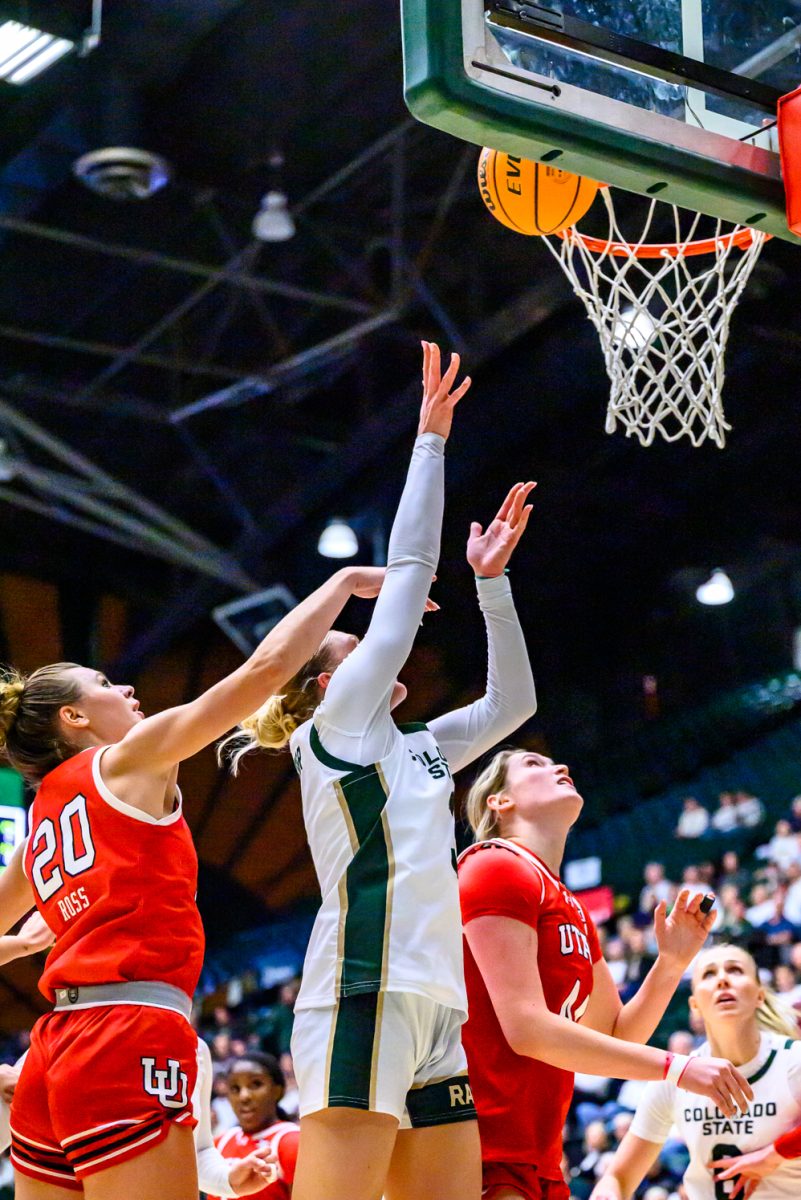 Colorado State University women's basketball guard Lexus Bargesser (3) shoots the ball while taking pressure from University of Utah defenders Dec. 4. Bargesser scored 19 points for CSU by the end of the game, the most points scored by any player on the team.