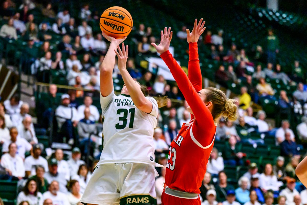 Colorado State University women's basketball guard McKenna Murphy (31) makes a shot while avoiding University of Utah guard Maty Wilke (23) Dec. 4.