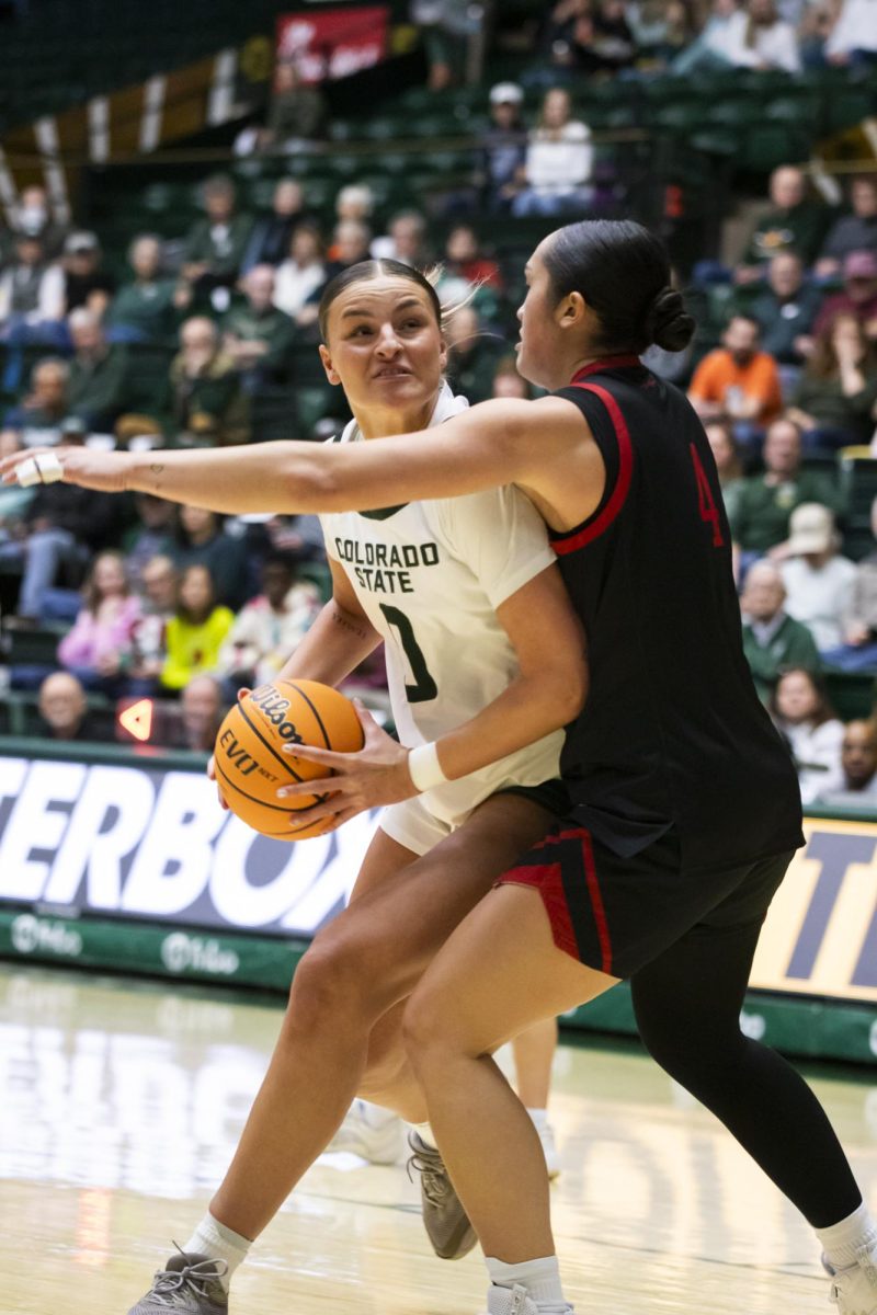 Senior Madelyn Bragg (0), a forward for Colorado State University, challenges opponent Brooklyn Fely (4) in game against Southern Utah. CSU played in Moby Arena and won 70-47 Dec. 7.