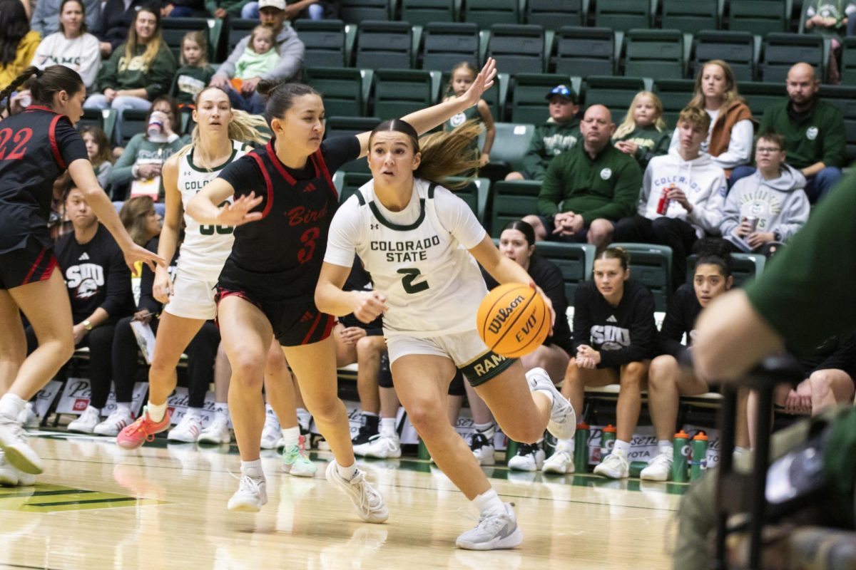Sophomore Brooke Carlson (2), a guard for Colorado State University, dribbles the ball around opponent Sierra Chambers (3) in game against Southern Utah. CSU played in Moby Arena and won 70-47 Dec. 7.