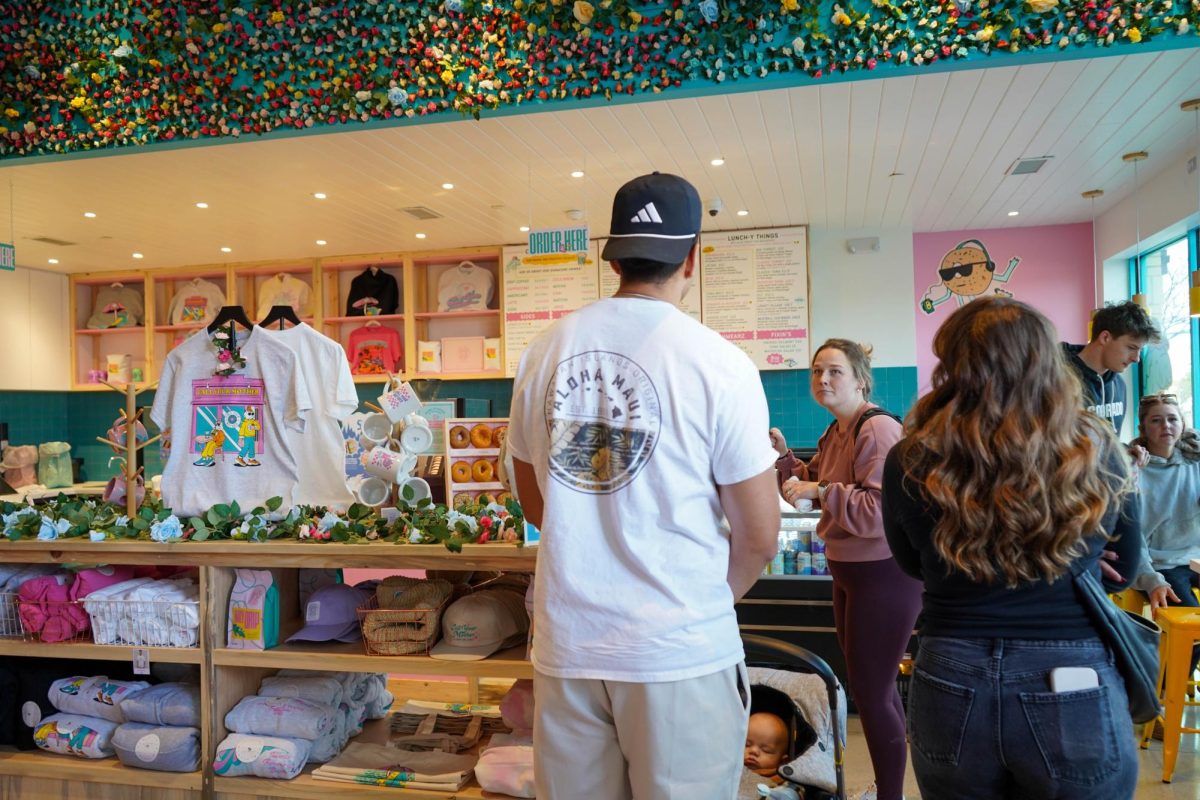 Customers wait to place orders at Call Your Mother Deli in Fort Collins Dec. 12. The popular bagel chain opened their new location in Old Ton on Oct. 27.