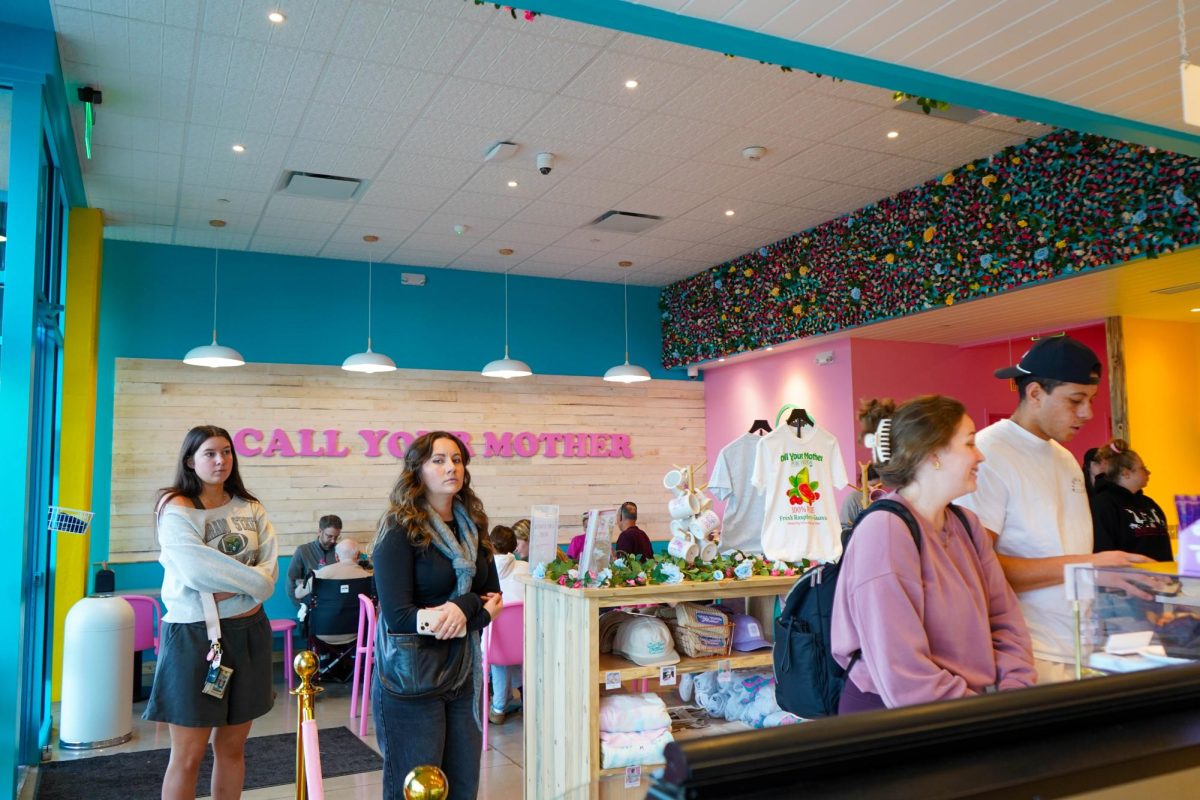 Customers wait to place orders at Call Your Mother Deli in Fort Collins Dec. 12. The popular bagel chain opened their new location in Old Ton on Oct. 27.