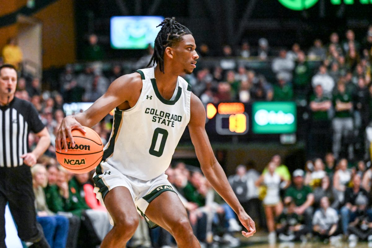 Colorado State University men's basketball forward Carey Booth (0) stalls while waiting for a teammate to open up during CSU's game against Utah State University Jan. 23.