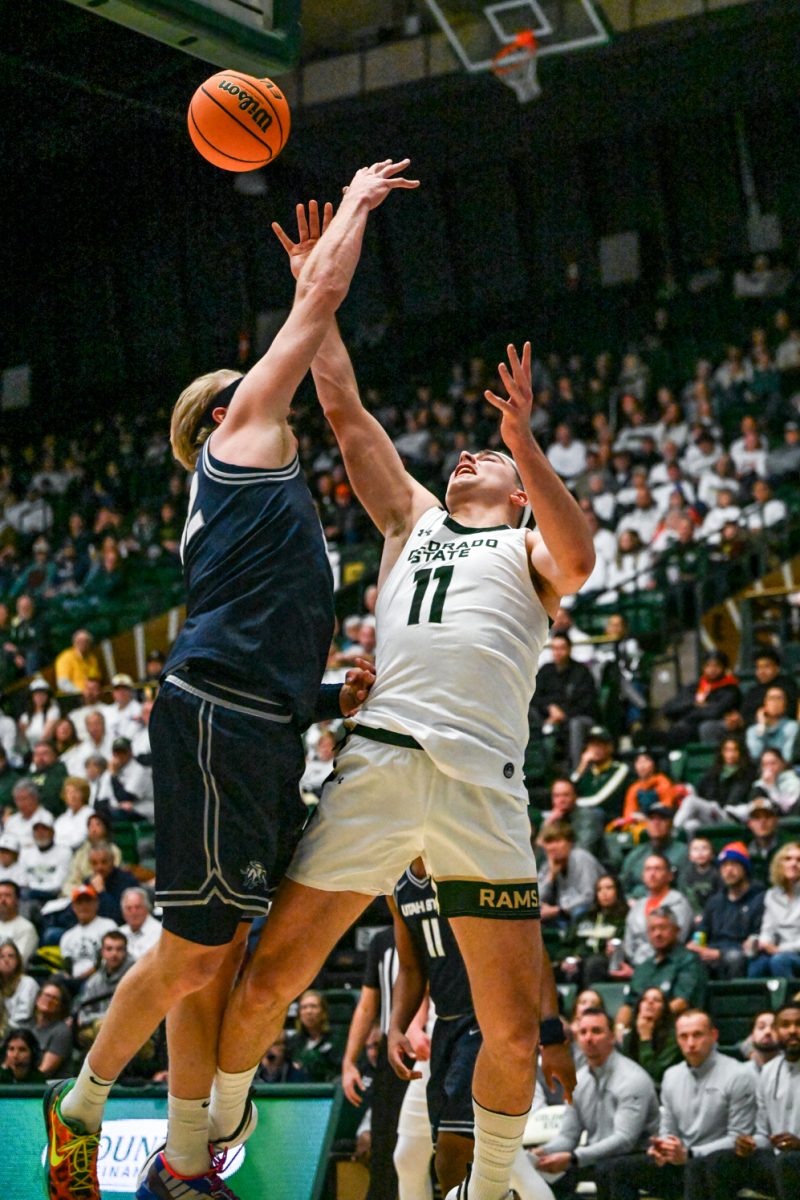Colorado State University men's basketball forward Augustinas Kiudulas (11) takes a shot through a Utah State University defender during CSU's game against UVU Jan. 23.
