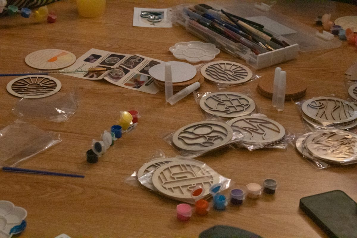 A table is covered in supplies for arts and crafts in the Pride Resource Center Jan. 28. These supplies were provided to community members during “We Craft It” Wednesday, an event hosted by the PRC. As part of the center’s Rainbow Ram Welcome series, the event offered shrinky dinks, knitting, painting, beading and more. The event was hosted to encourage students to connect with the center and other community members.