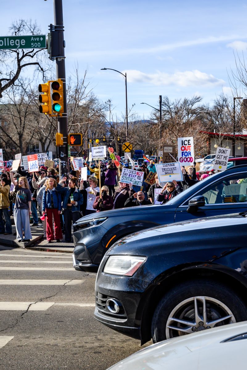 Protesters crowd the sidewalk of College Avenue to demonstrate against ICE as part of a national strike effort Jan. 30.