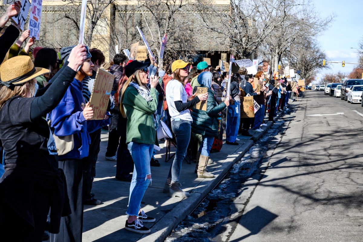 Protesters crowd the sidewalk of College Avenue to demonstrate against ICE as part of a national strike effort Jan. 30.
