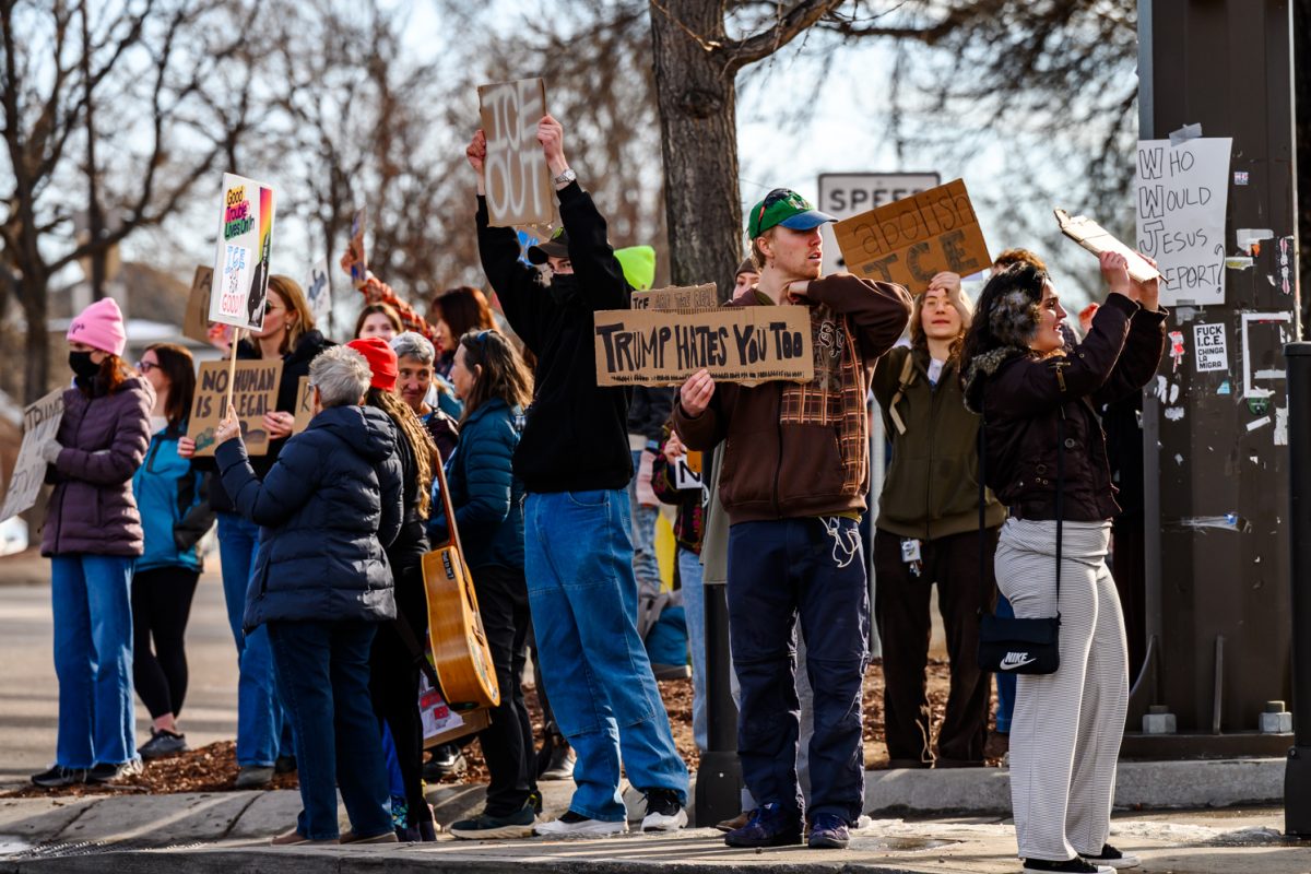 Protesters crowd the sidewalk of College Avenue to demonstrate against ICE as part of a national strike effort Jan. 30.