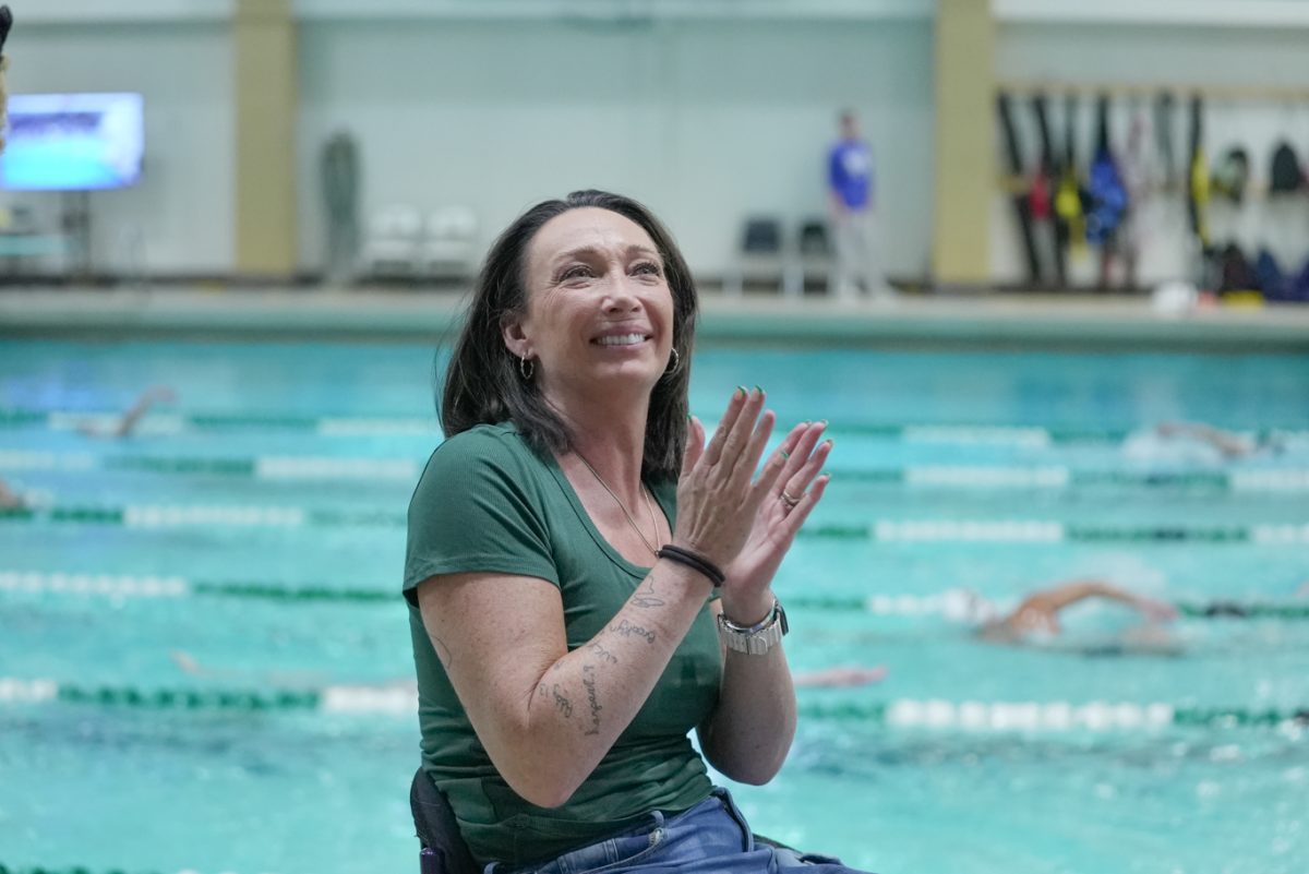 Amy Van Dyken looks up to the crowd at Moby Pool as she is recognized as part of her induction to Colorado State University's Ring of Honor class Jan. 24. Van Dyken had banners in her honor hung in Moby Arena and Moby Pool. 
