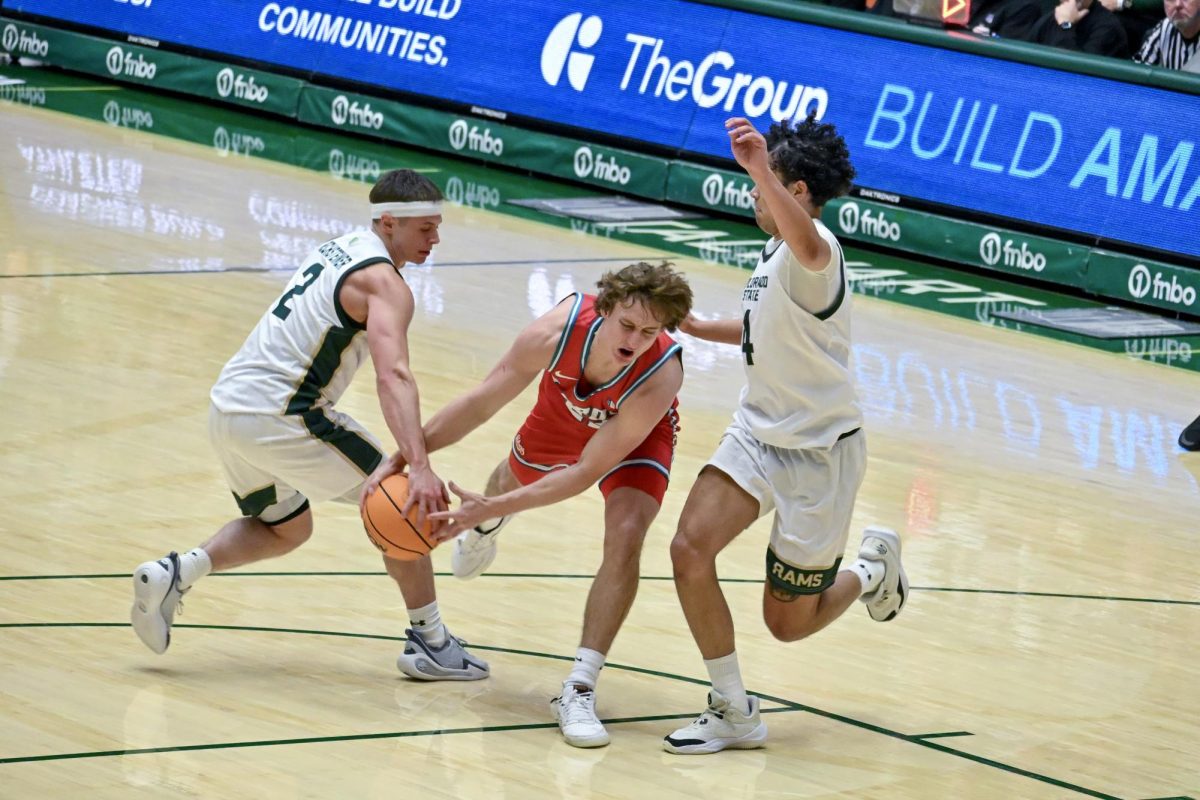 Brandon Rechsteiner steals the ball from an offensive University of New Mexico player in Colorado State University's home game against the Lobos Jan. 6. CSU lost 80-70.