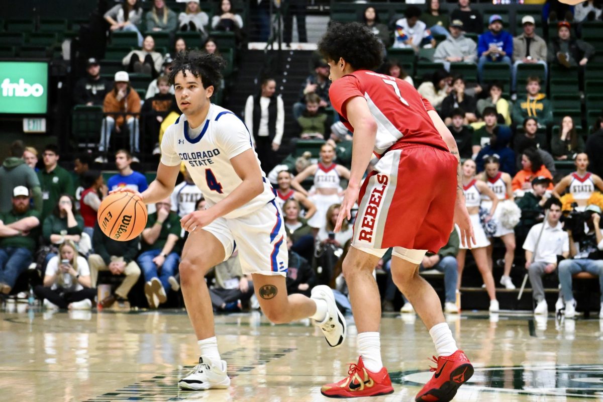 Jase Butler runs down the court in Colorado State University’s state pride game against UNLV Jan. 9. CSU won 70-62.