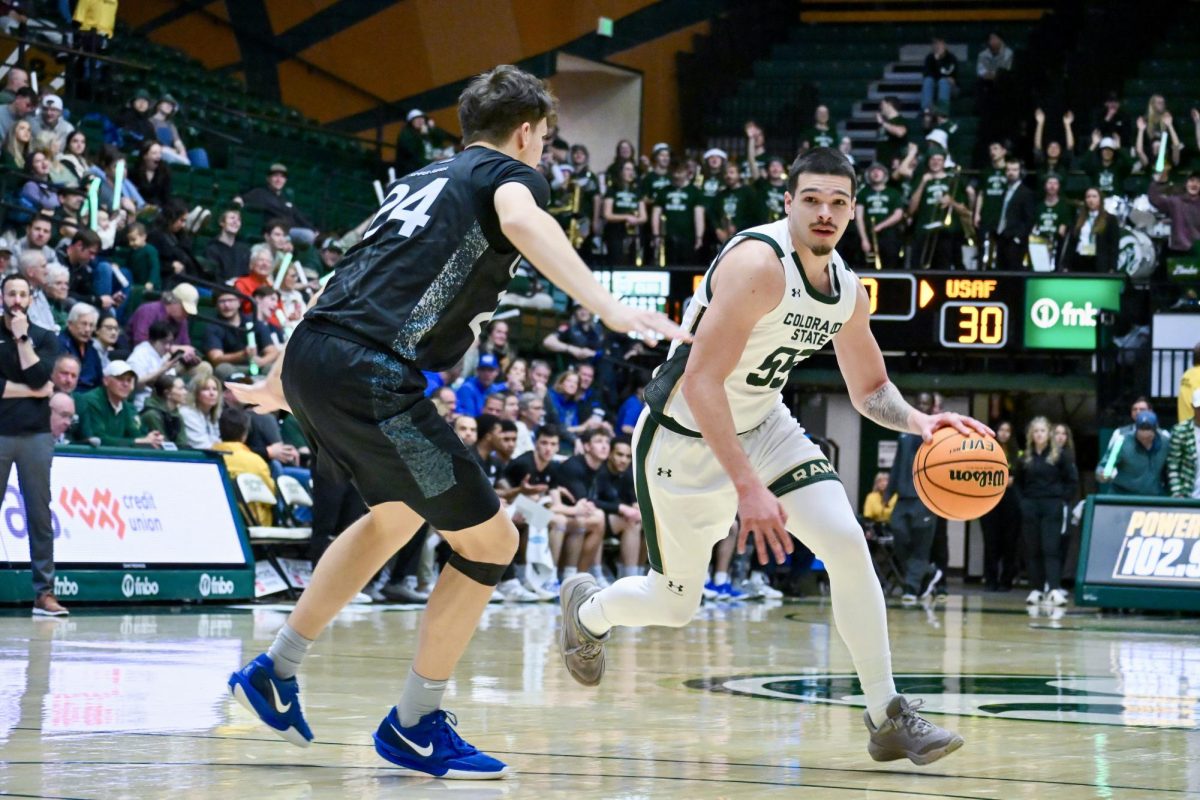 Jevin Muniz (55) runs past an Air Force defender in Colorado State University’s home game against the Falcons Jan. 20. CSU won 81-52.