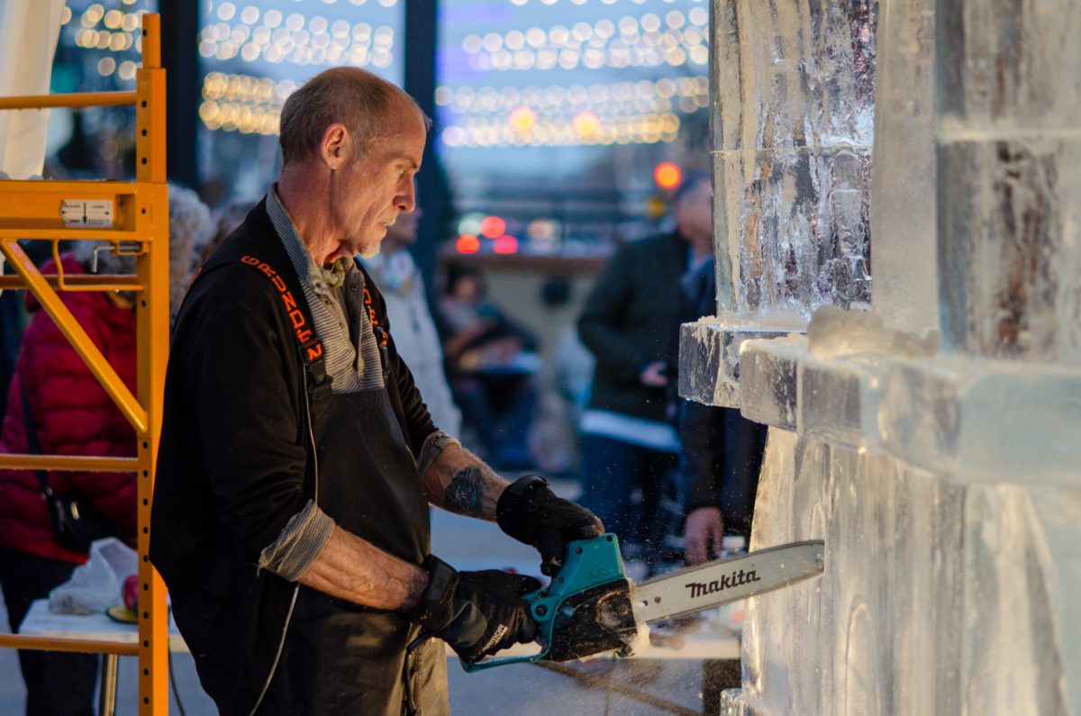 Thomas Barlow of Struckman Sculpture Ice carves into ice for the Fourth Annual Live Ice Carving in Old Town Square Feb. 6. Barlow is a local Colorado artist who works on projects across the Front Range. He sculpts with diverse mediums, including marble, wood, sand and ice.