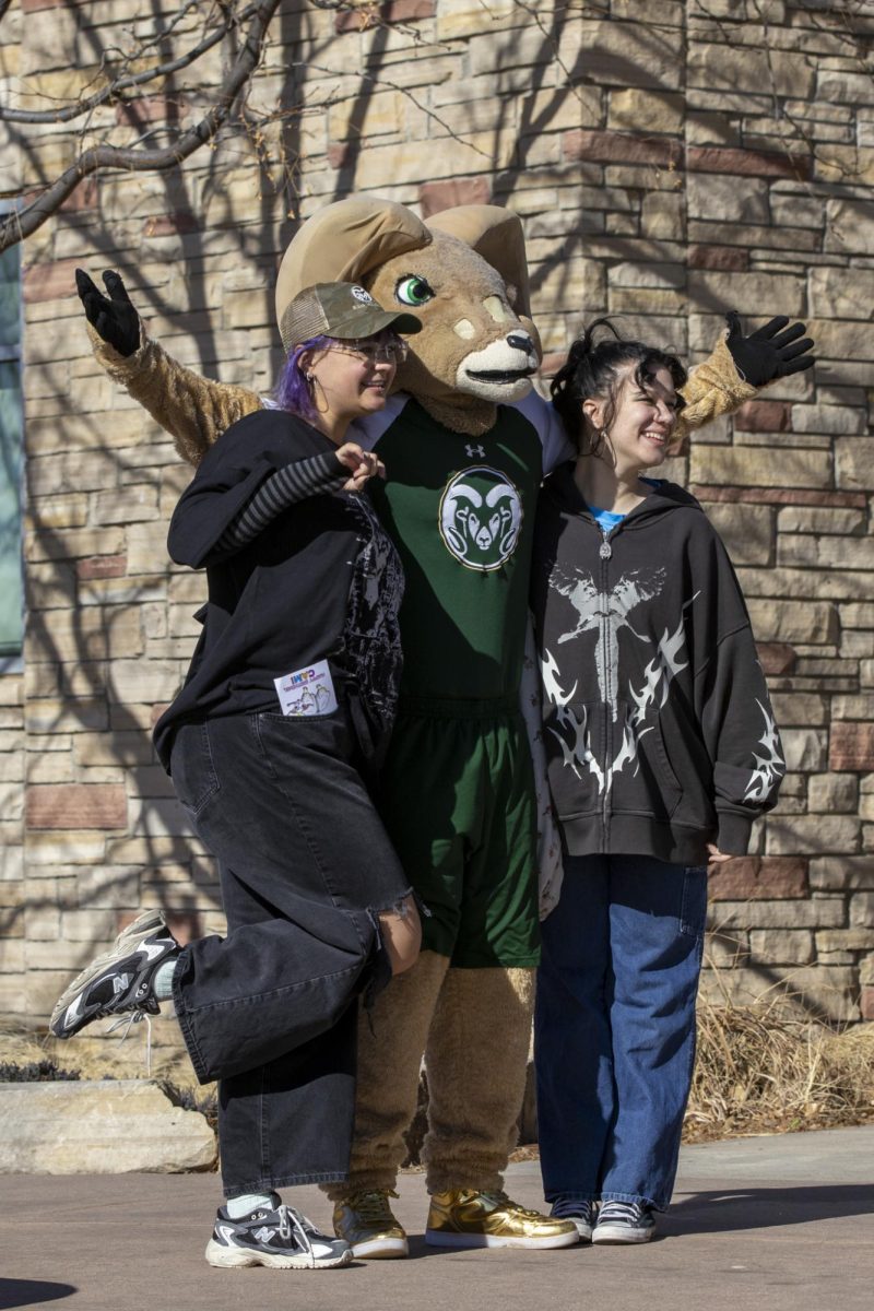Colorado State University students pose for a picture with CAM the Ram at his 72nd birthday party. This event was put on at the CSU Student Recreation Center by the Alumni Association, Feb. 7