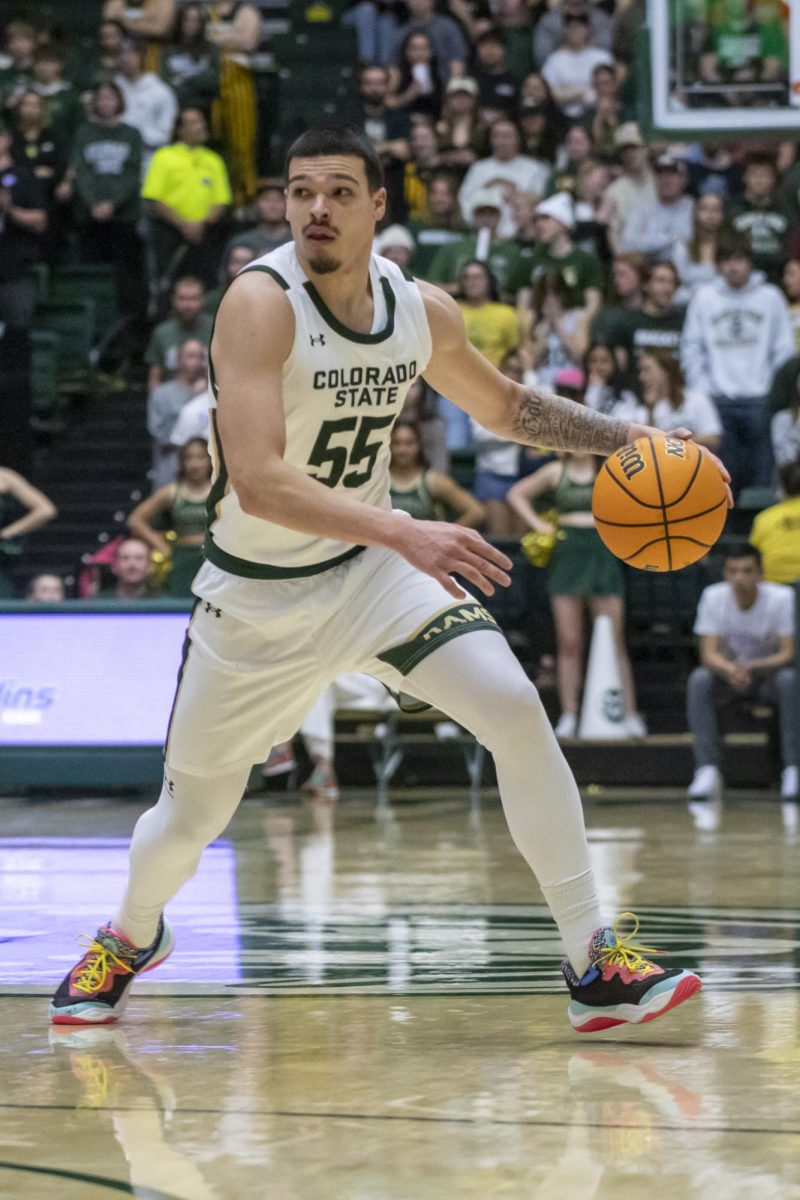 Guard Jevin Muniz (55) dribbles the ball in game against San José State University. The Colorado State University Rams won 65-57 in their game played at Moby Arena. Feb. 7