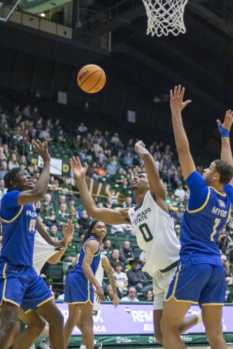 Colorado State University men's basketball forward Carey Booth (0) fights for the ball during CSU's game against San Jose State University Feb. 7