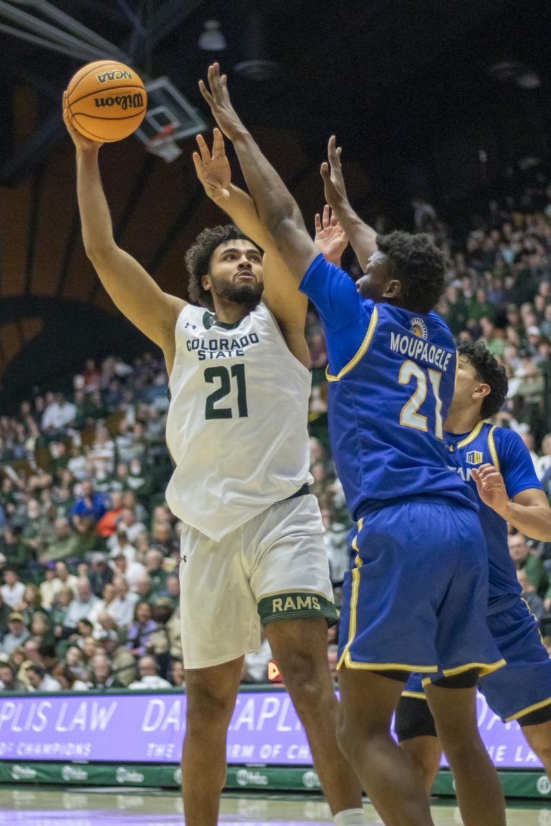 Colorado State University men's basketball forward Rashaan Mbemba (21) rebounds the ball during CSU's game against San Jose State University Feb. 7. Mbemba scored 11 points through the game. 