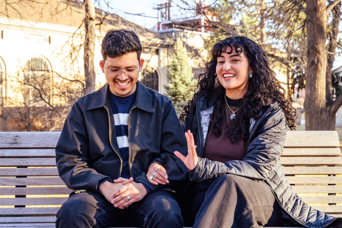 Colorado State University graduates Claudia Perez and Jesus Calderon smile as they talk about how they started dating on the CSU Oval Feb. 7. Perez and Calderon met at CSU in 2017, when Perez was a sophomore and Calderon was a junior, at the El Centro welcome back barbecue. "We love coming up to Fort Collins because it's very nostalgic,"  Perez said. "Especially since we met each other in the fall, we try to make the point of coming up here during that part of the year."