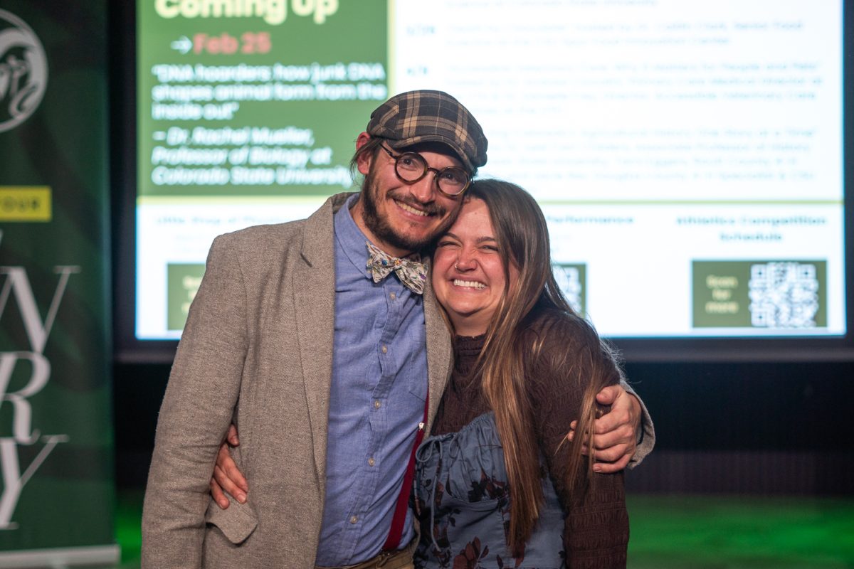 Tristan Kubik and Melissa Schreiner pose for a photo after their debate in the Visit Fort Collins Welcome Center Feb. 11. “And of course, if you notice any familiarity between us tonight, that is because we are on our own little love adventure," Kubik said. "We do not regularly hug and kiss our co-presenters."