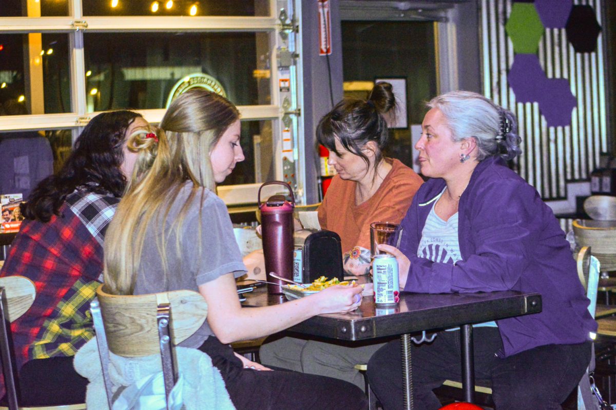 Maryanne Downey, Jamie Kachel, Elena Rentz and Sam Mollenkamp enjoying their food awaiting Valentines Drag Bingo to begin Feb. 11. "We decided to do a valentines thing with the girls" Maryanne Downey states "Some of us have never played bingo before or been to anything drag related, so were kind of excited for that." 