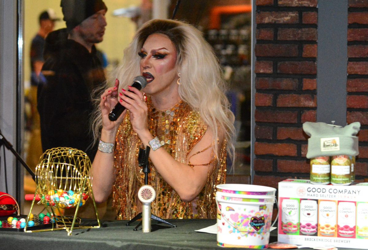 Krisa Gonna announcing the bingo numbers to the large crowd after her performance Feb. 11.  Krisa Gonna was the host of the Valentines Drag Bingo night at the Breckenridge Brewery and performed multiple numbers throughout the night. 