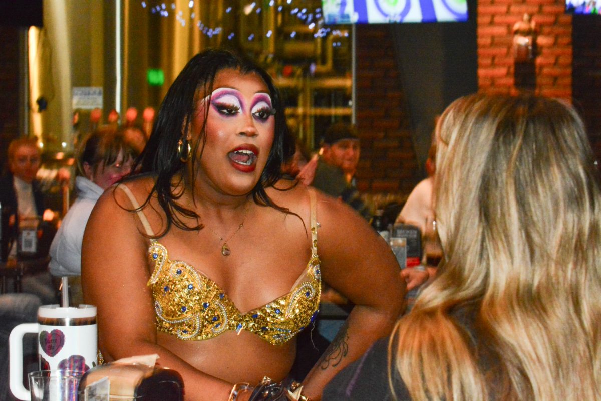 Zimmorah Mei sings to a crowd member Feb. 11. Zimmorah Mei performed multiple numbers during the Valentine Drag Bingo. 